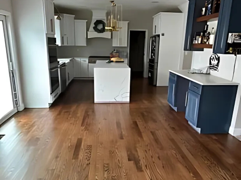 Beautiful hardwood floor refinished by Mobile in a modern kitchen after a sand and finish Southington Ct project.