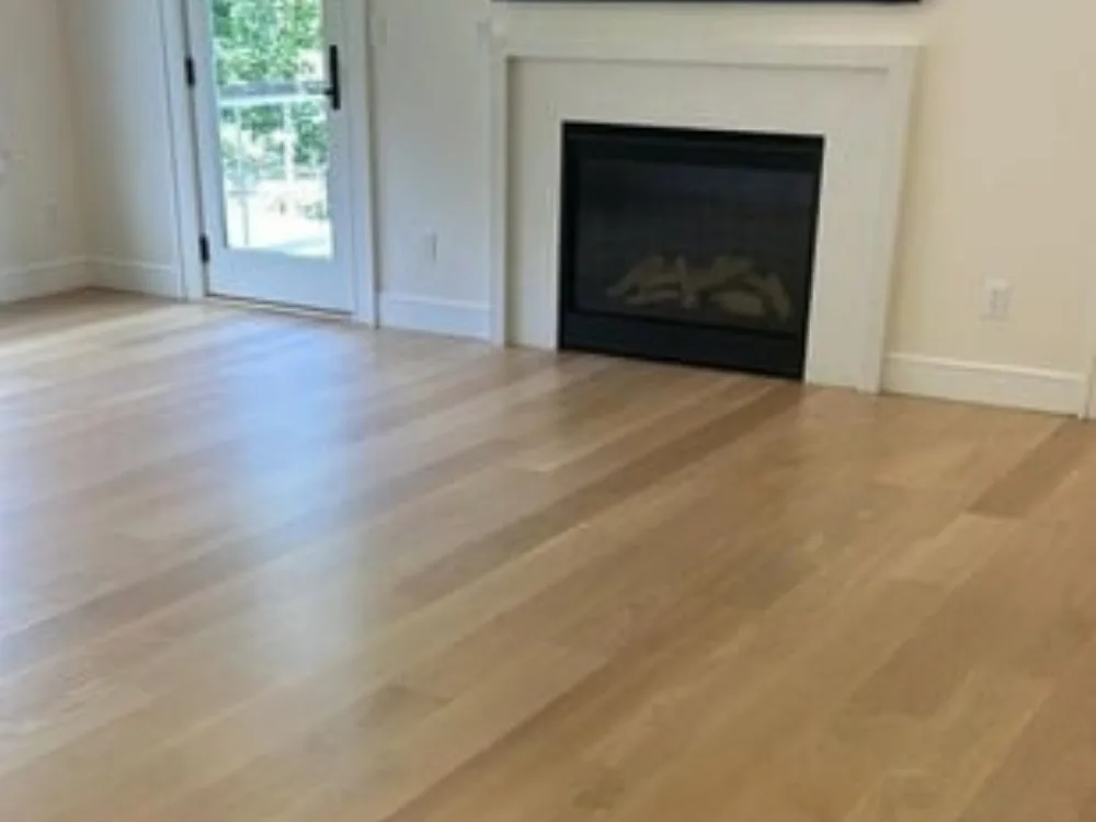 Living room with natural water-based floor refinishing in Westport