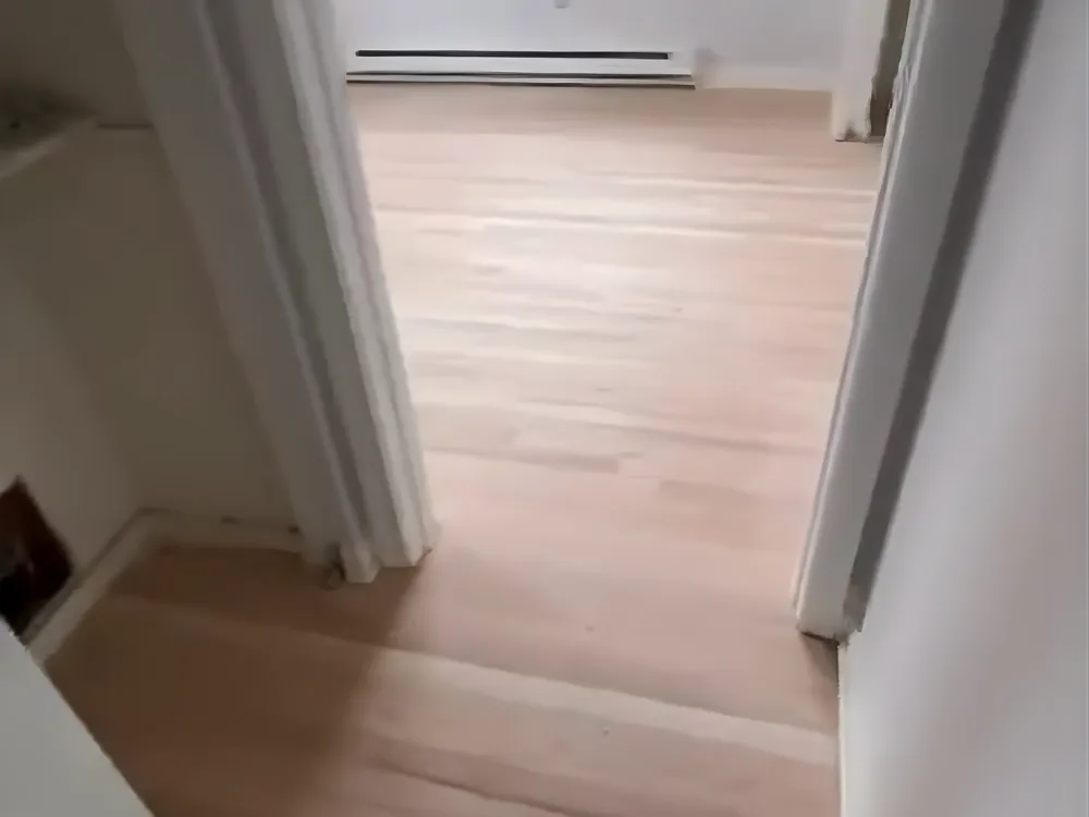Smooth hardwood floor after sanding process completed.