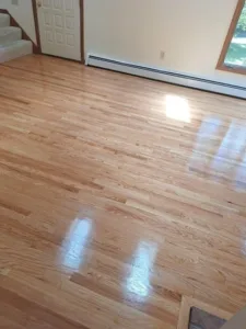 Completed refinishing floor Amston CT with smooth glossy finish