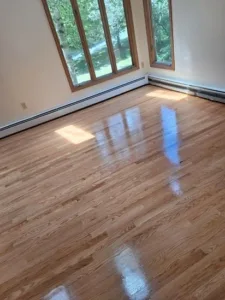Restored hardwood room after refinishing floor Amston CT