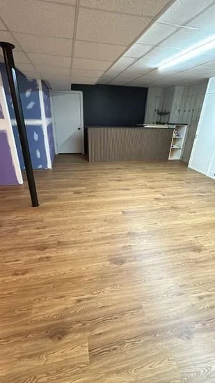 Completed floor looking toward a custom bar area after a flooring installation Bristol CT.