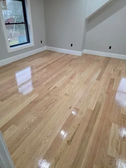 Detailed view of natural wood grain after a professional hardwood sand and finish service.