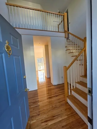 View of an entry and hallway featuring the hardwood sand and finish.